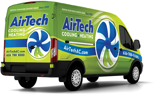 A green AirTech service van with blue and white branding for cooling and heating, featuring a large fan graphic and company contact information.